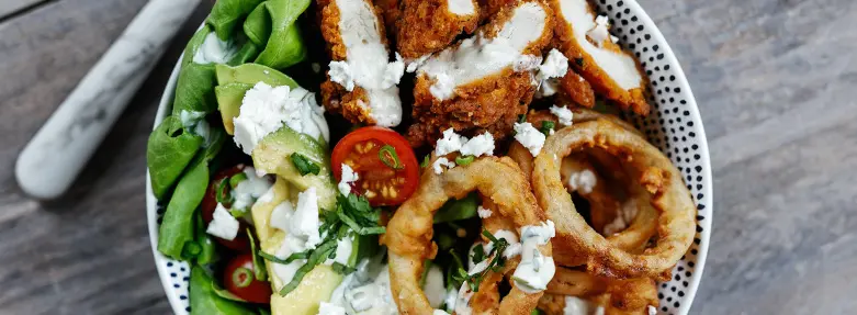 Hot & spicy chicken and onion ring salad bowls
